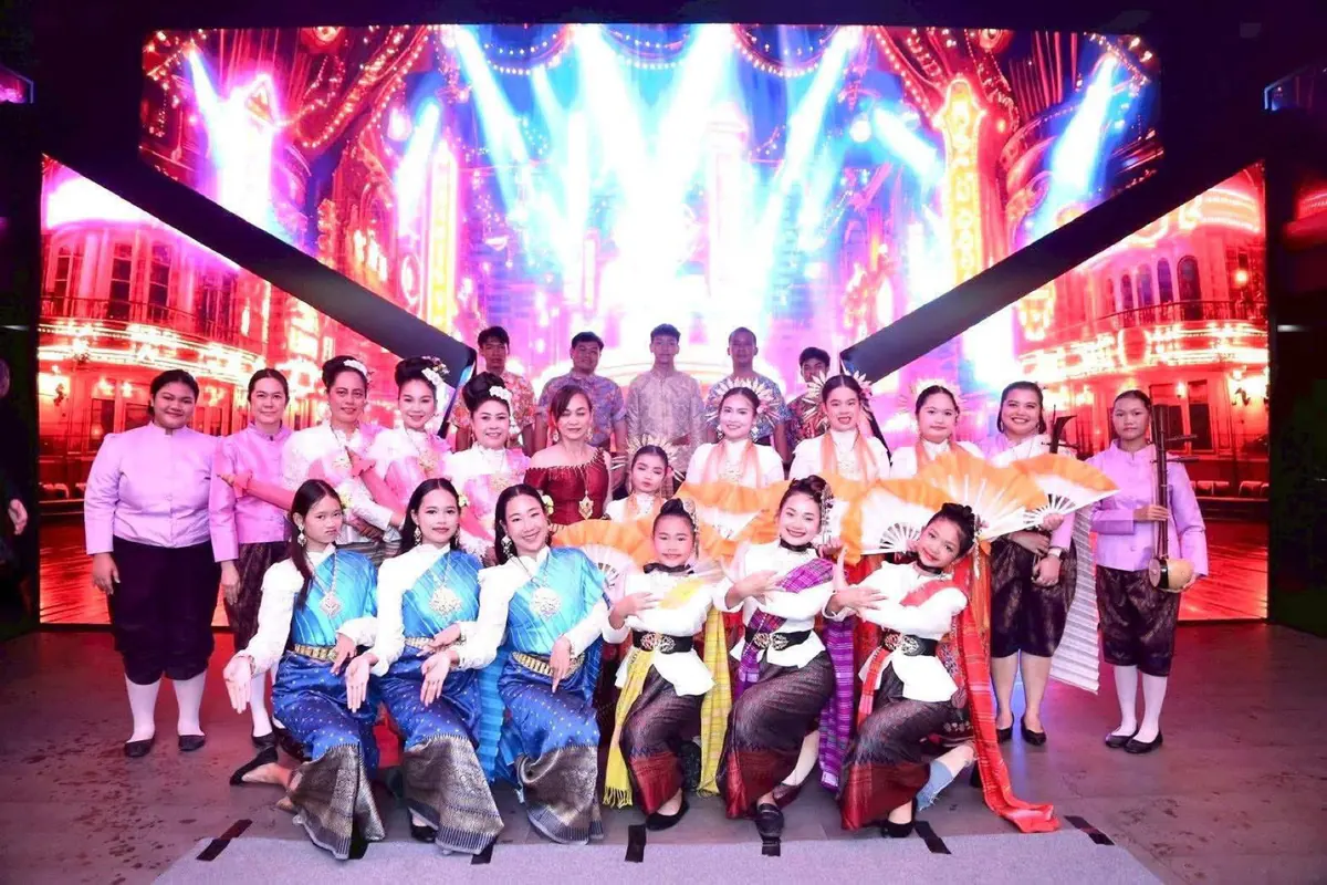 Young dancers from Thailand sharing a stage with their ensemble