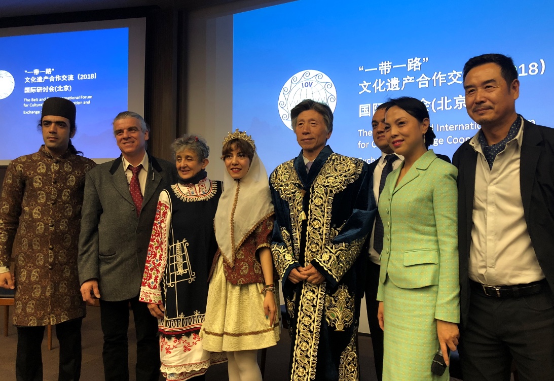Participants in cultural dress gathered at an international cultural heritage forum in 2018